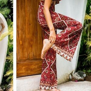 Le salty label hibiscus flare pant in cherry. Size XS